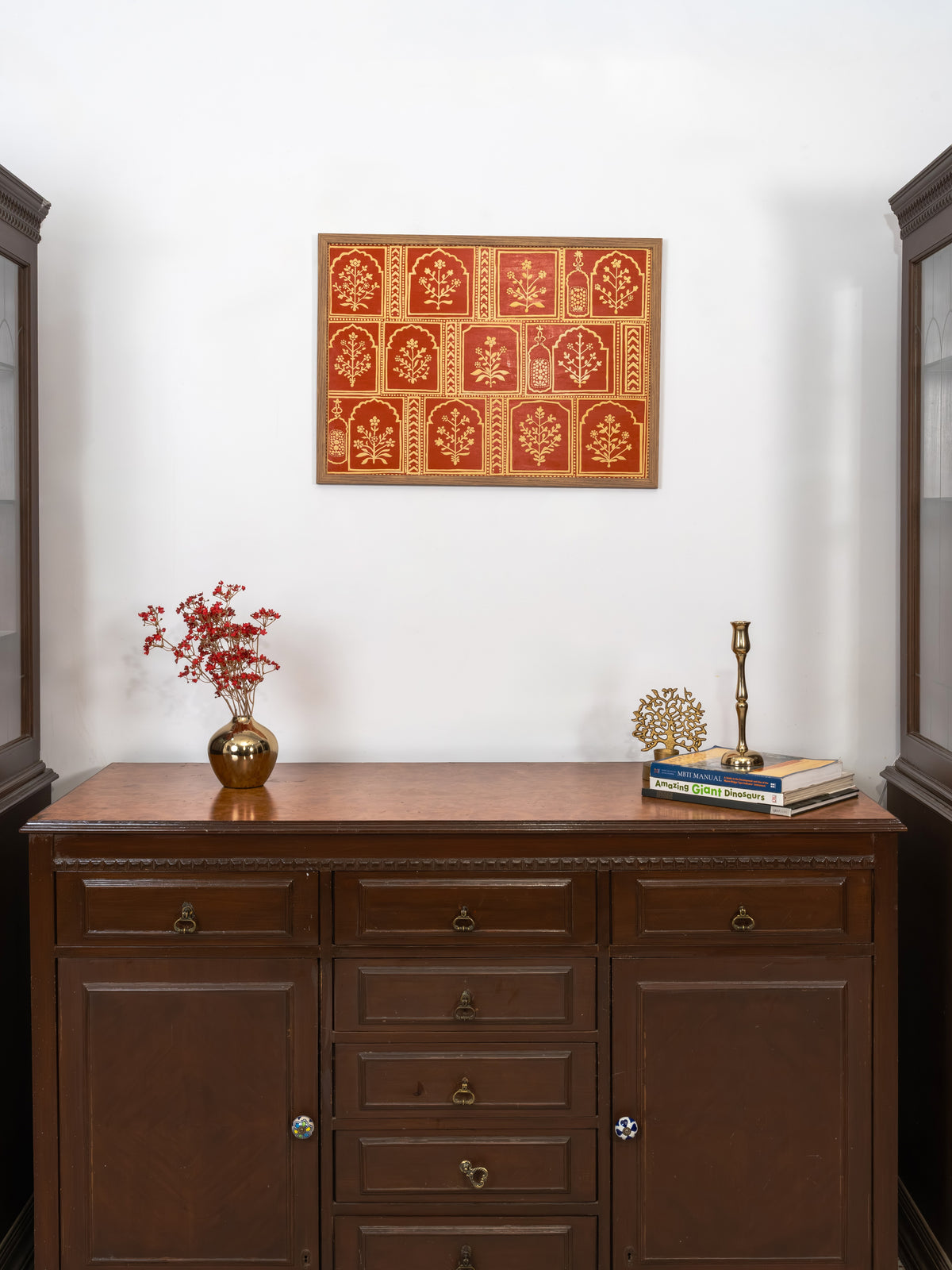Traditional mud relief and subtle mirror work in a rhythmic floral grid