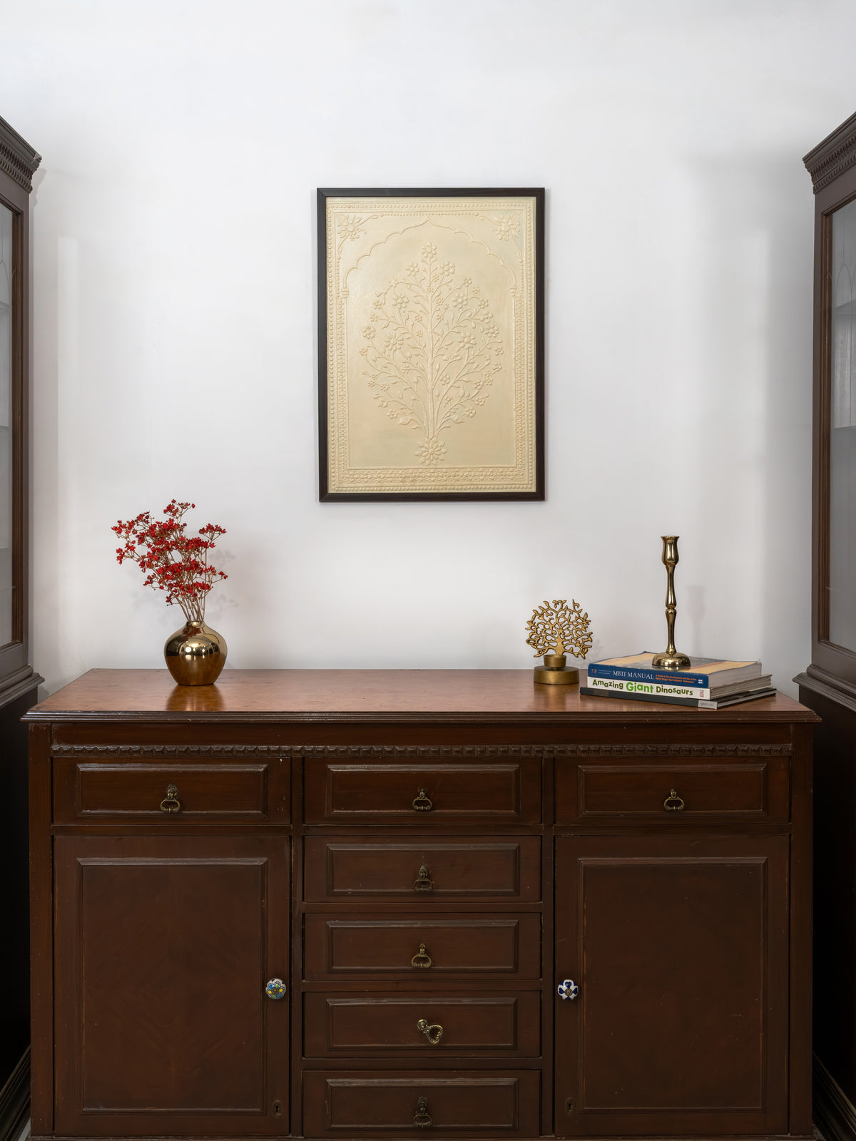 Sculpted Lippan relief evoking a garden glimpsed through a palace window