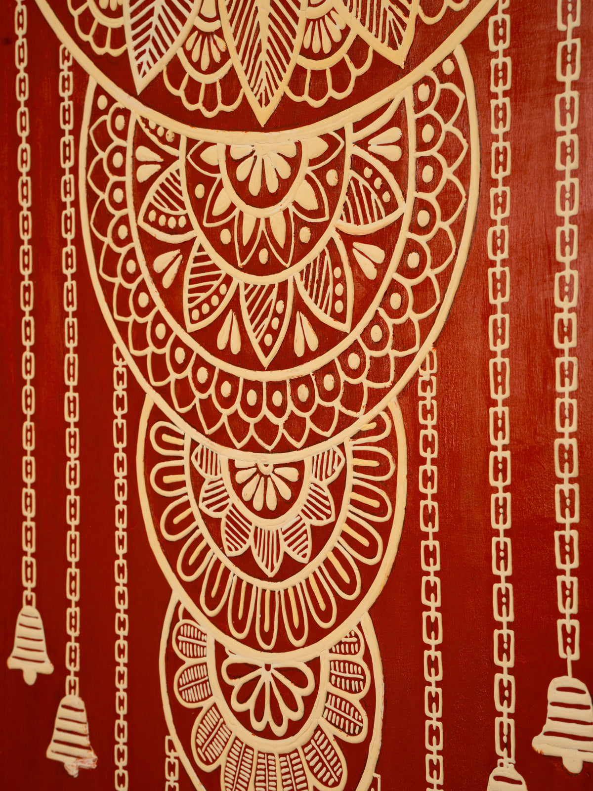 Detail of raised clay relief and mirror in the Temple Bells Mandala