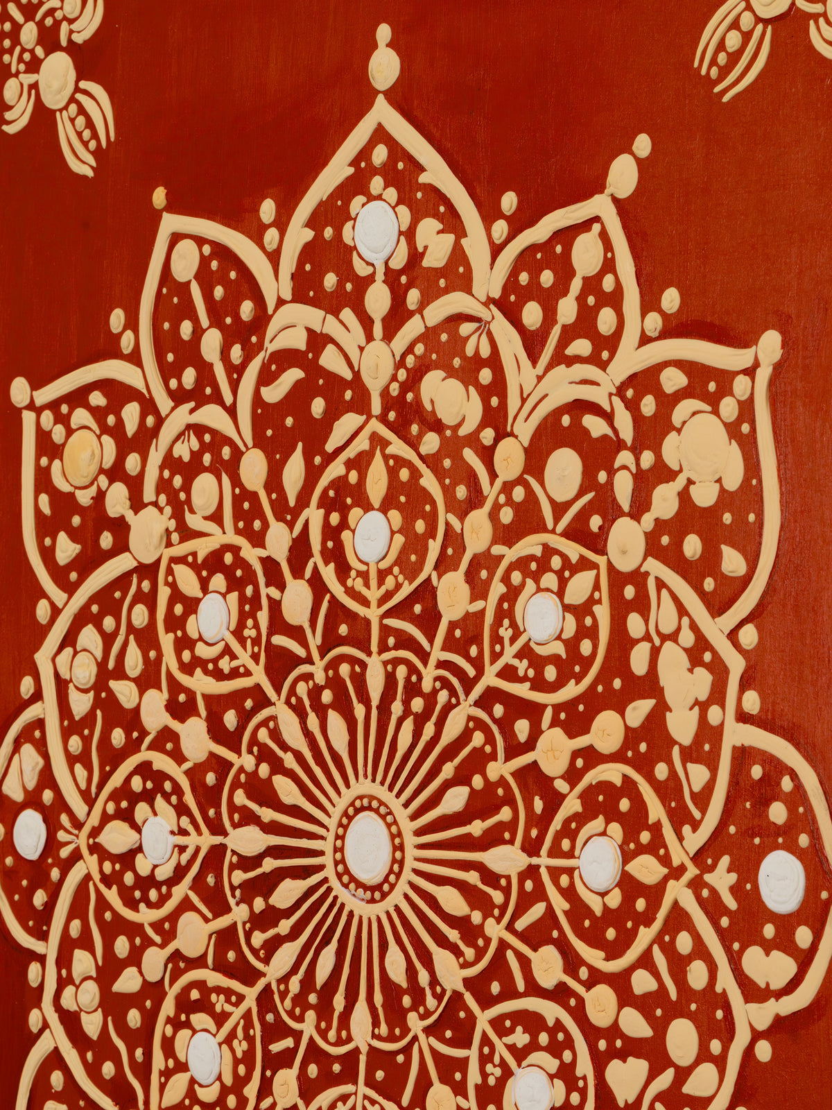 Detail of raised clay relief and inset mirror in Noir Petal Lattice II